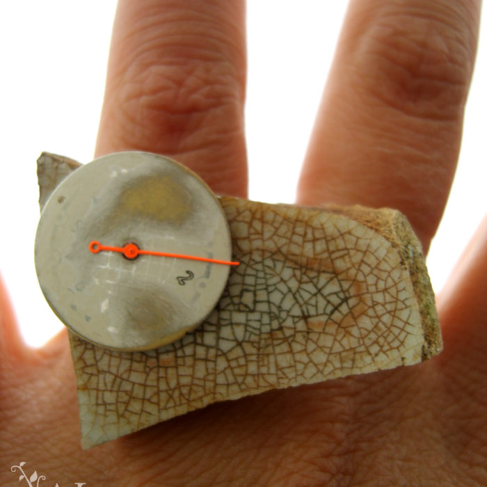 Ring with watch parts and aged ceramics
