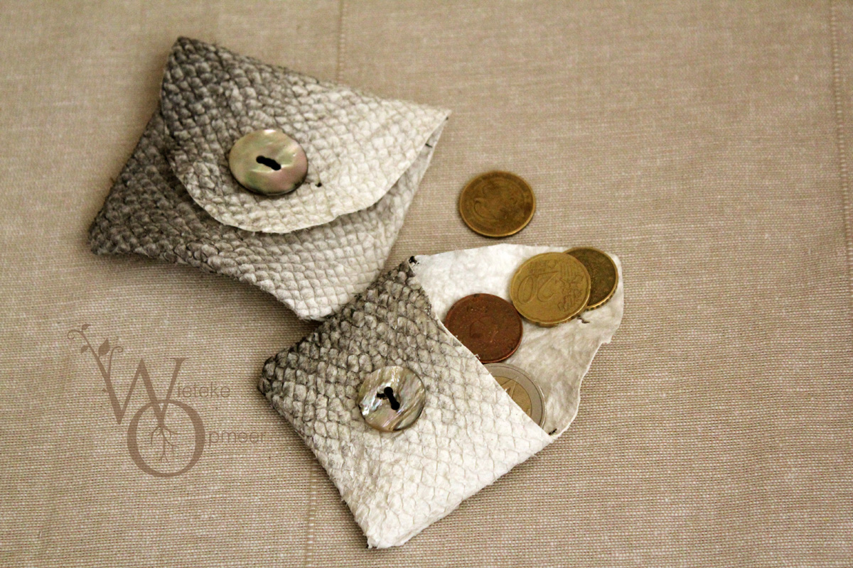 two small fishleather wallets with mother of pearl buttons